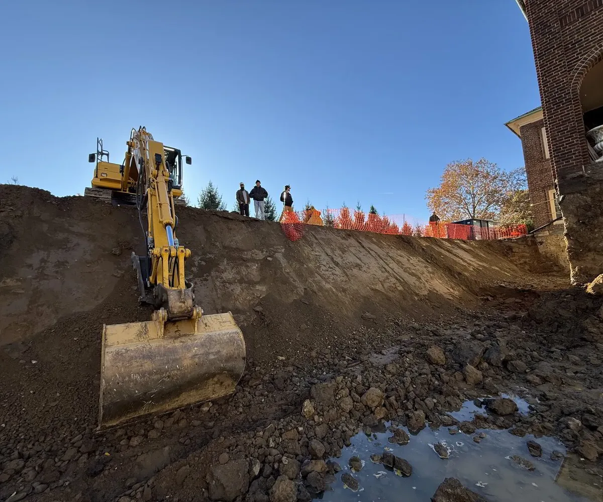 Excavator working a large residential excavation and grading project