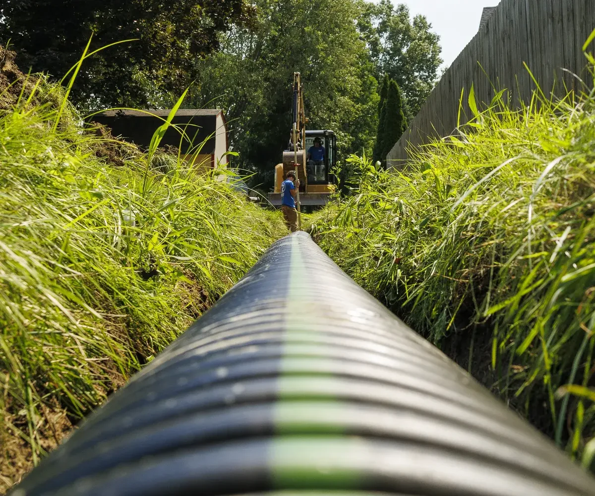 Large-diameter drain pipe laid in a freshly cut trench